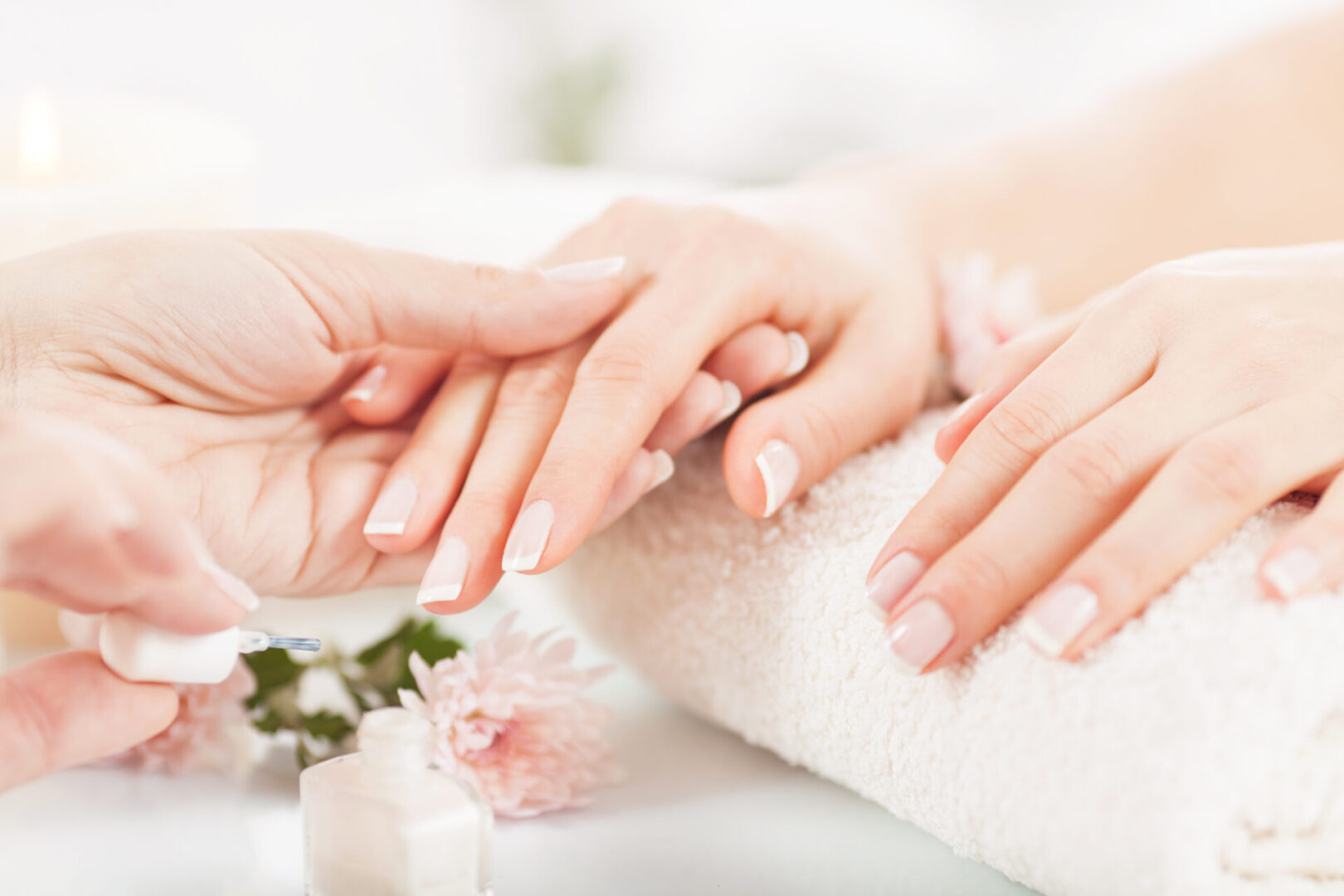 Hands receiving a manicure treatment